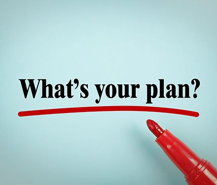 The words "what's your plan?" written in marker with a red marker laying beside it